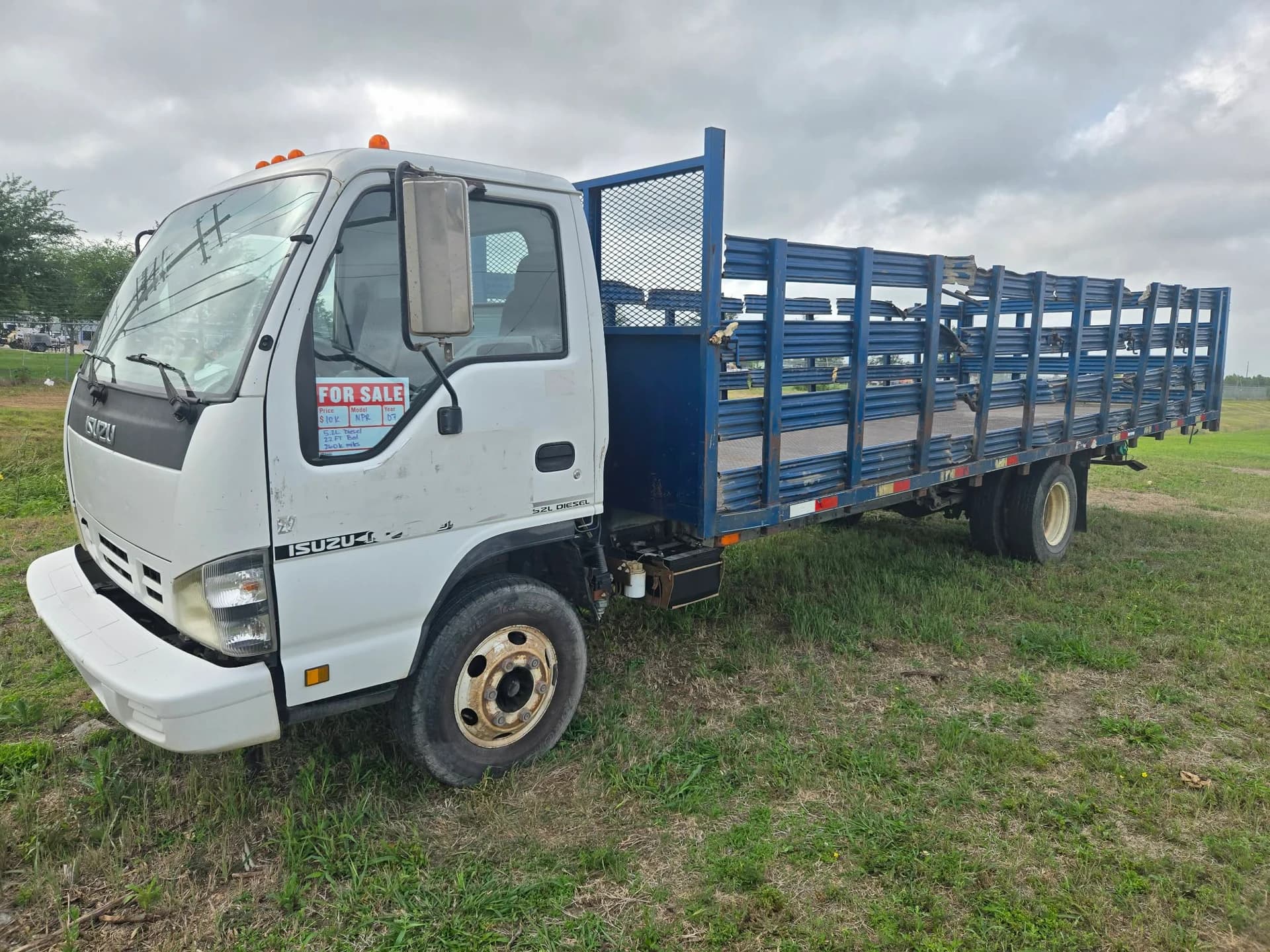 2007 Isuzu NPR stake-bed — photo 4 of 12
