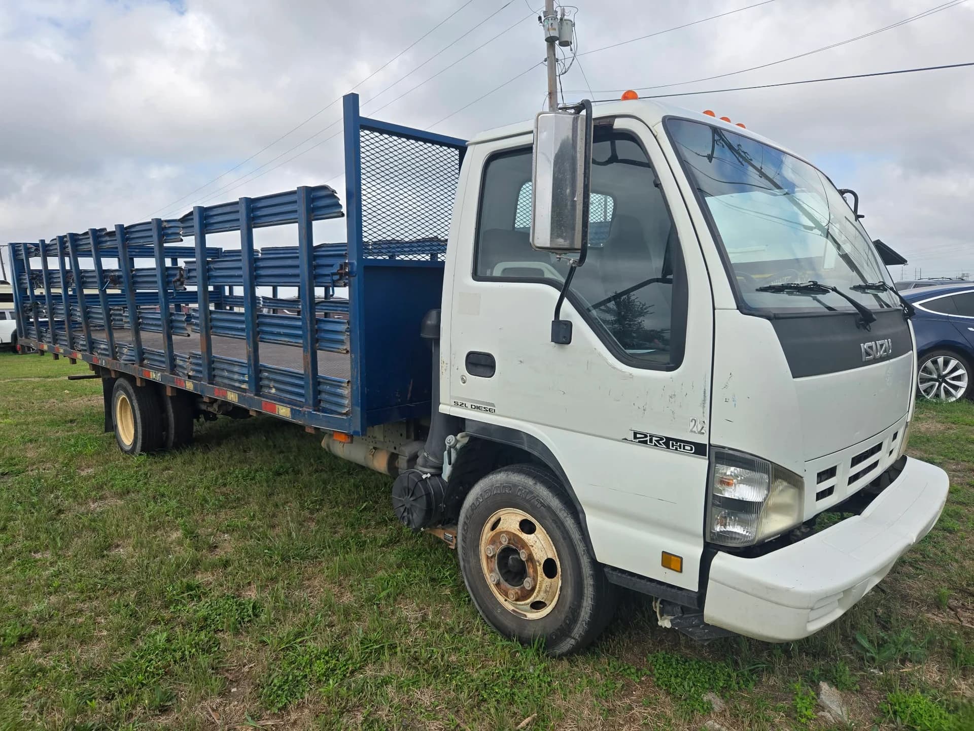 2007 Isuzu NPR stake-bed — photo 3 of 12