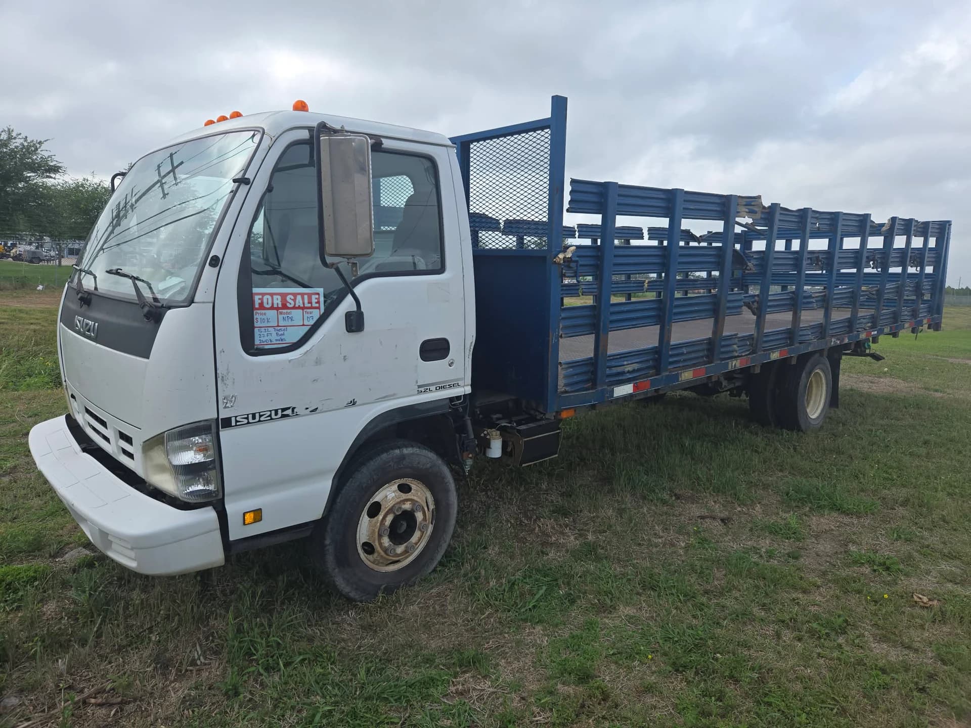 2007 Isuzu NPR stake-bed — photo 7 of 12