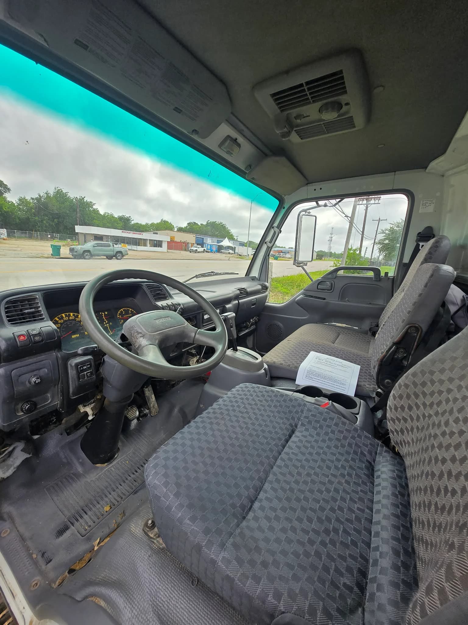 2007 Isuzu NPR stake-bed — photo 10 of 12